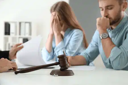 A distressed couple meets with a judge to discuss annulment in Montana and legal documents.