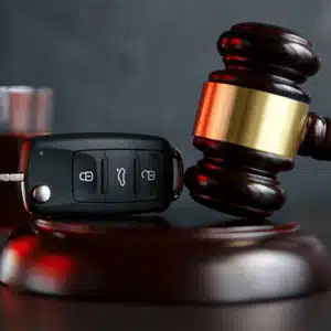 Gavel beside car key reflects court decisions on is a dui a felony in montana