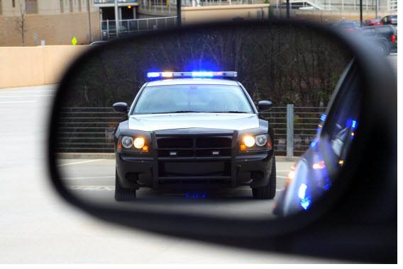 police car in rear mirror